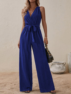Indigo textured wrap-front wide-leg jumpsuit with tie waist and V-neck