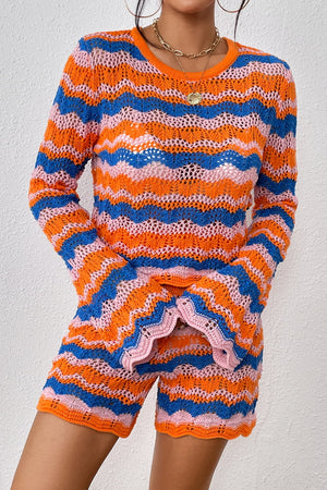 Crochet flare set with orange-red, blue, and pink zig-zag stripes, bell sleeves, and scalloped hem shorts.
