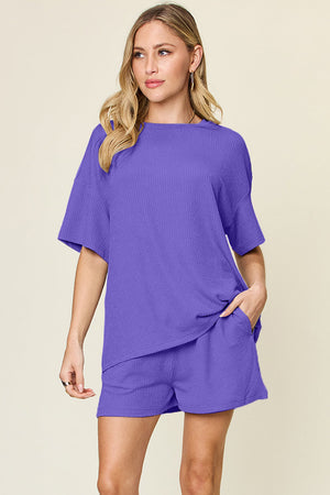 Waffle knit boxy tee and shorts set in purple with short sleeves and pockets.
