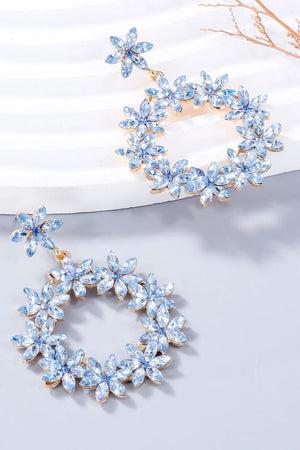 Light blue floral halo drop earrings with crystal accents and gold-tone alloy.