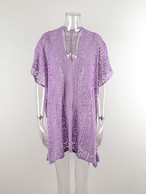 Lavender open-knit V-neck beach cover-up with short sleeves and a tasseled hem.