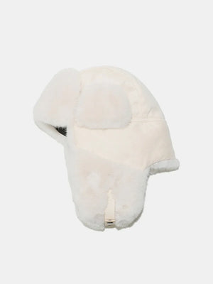 Ivory shearling aviator trapper hat with faux fur trim and ear flaps.