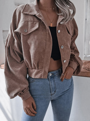Brown corduroy cropped jacket with balloon sleeves and button-up front.
