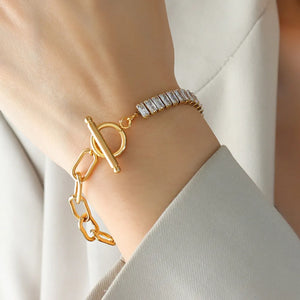 Gold chain toggle bracelet with baguette zirconia accents