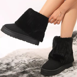 Black faux fur platform ankle boots with a cozy lining.