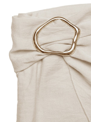 Cream mini skirt with knotted detail and gold buckle accent