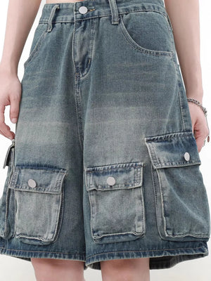Men's blue denim cargo shorts with multiple pockets and a faded wash.