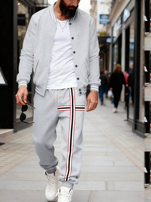 Men's light gray tracksuit set with striped track pants and bomber jacket.