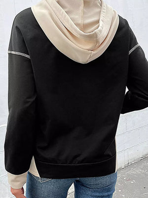 Black and beige cotton hoodie with contrast stitching and drawstring hood.