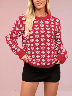 Red argyle knit sweater with white hearts and diamonds, crew neck, long sleeves.