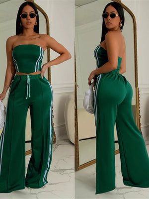 Dark green tube top and wide-leg pant set with white stripe detail and drawstring waist.