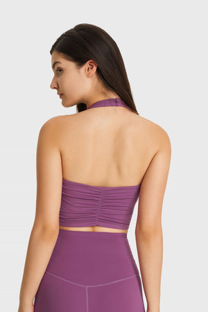 Purple halter neck sports bra with ruched back detail