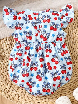Baby one-piece with cherry and star print, ruffle sleeves, and a light blue cotton fabric.