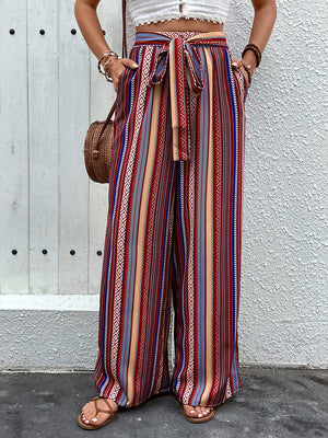 Bohemian stripe palazzo trousers in rust with tie-waist and wide leg