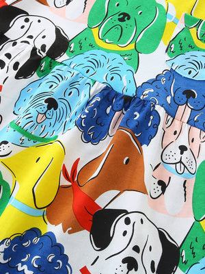 Toddler dress with a colorful cartoon dog print and gathered waist detail.