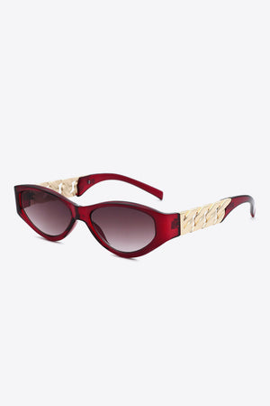 Deep Red cat-eye sunglasses with white frame and gold chain detail.