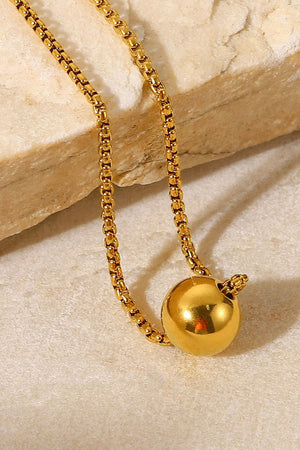 Golden Orb pendant necklace with a box chain.