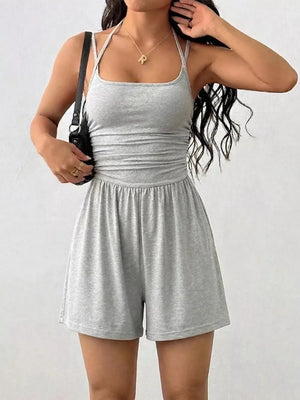 Light gray ruched spaghetti strap romper with a square neckline and elastic waist.