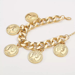Chunky gold-plated chain bracelet with coin charms and adjustable clasp.