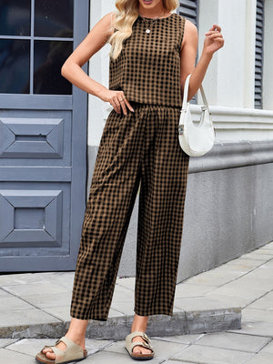 Gingham cropped tank and tapered trouser set in caramel, styled with a white handbag.
