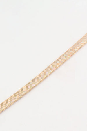 Slimline rose gold elastic waist belt with ribbed texture detail