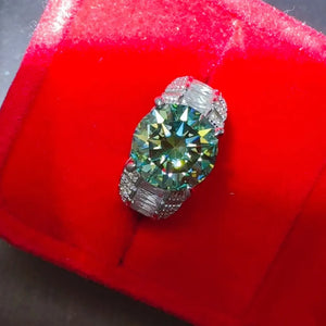 Silver band ring with large emerald cut moissanite and baguette side stones.