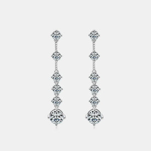 Silver cascading diamond drop earrings with multiple brilliant-cut stones.