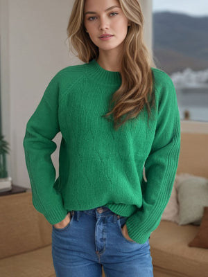 Dark green textured knit raglan sleeve pullover sweater with a mock neck and ribbed cuffs.