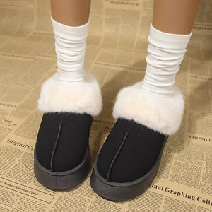 Black plush suede platform slippers with white faux fur trim and grey soles.