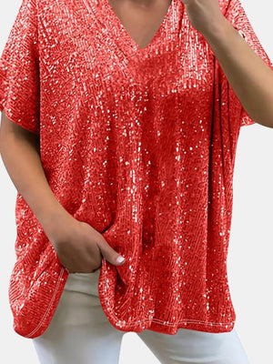 Red sequin slouchy v-neck top with short sleeves and a relaxed fit.