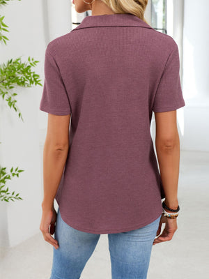 Burgundy waffle knit button placket t-shirt with collared neckline and short sleeves.