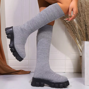 Gray knit knee-high boots with chunky platform soles