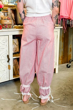 Lace-trimmed stripe wide-leg maternity pants with drawstring and tie ankles.