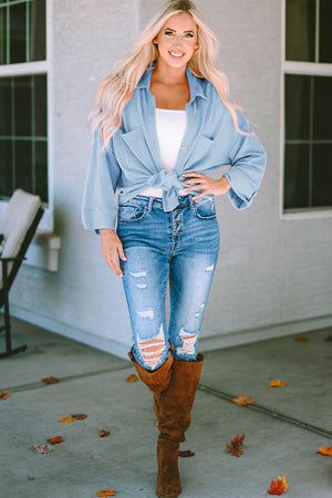 Light blue textured stripe overshirt with oversized fit, button front, and chest pockets.