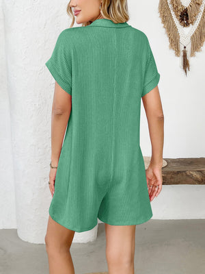 Green ribbed knit romper with short sleeves, collar, and patch pockets.