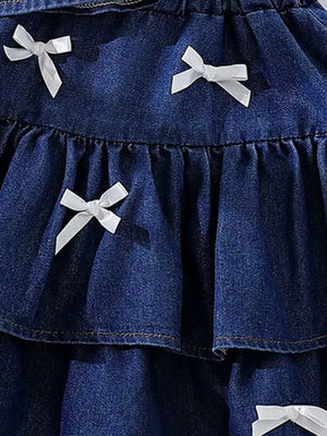 Dark navy denim halter set with white bow accents and ruffled tiers.