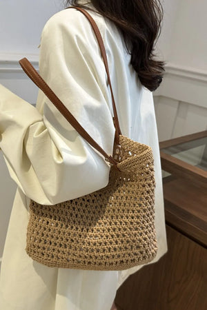 Crochet weave shoulder bag in camel with leather straps.