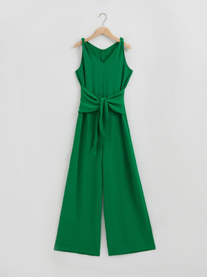 Emerald green tie-waist wide leg jumpsuit with V-neck and tie shoulder straps.