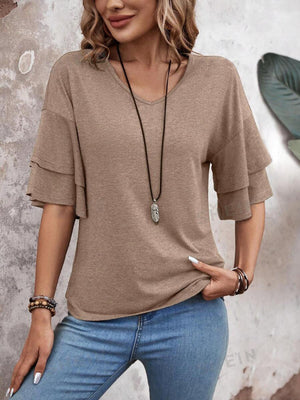 Mocha jersey tee with tiered short sleeves and V-neck, styled with jeans and necklace.