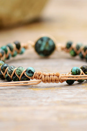 Turquoise beaded bracelet with braided cord detail