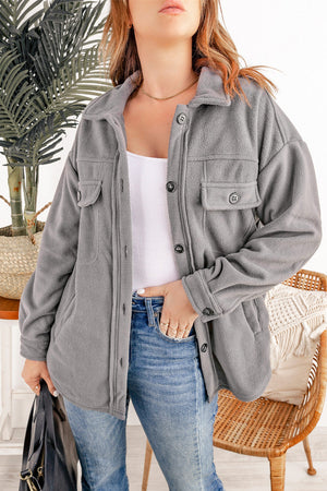 Fleece shirt jacket in Charcoal with patch pockets, button front, and collar.