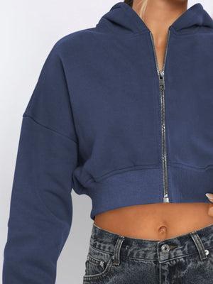 Navy cropped zip-up hoodie with ribbed hem and silver zipper detail.
