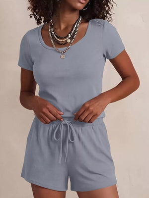 Blue scoop-neck tee and drawstring shorts set with button detail on shoulder.