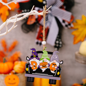 Halloween car ornament set with three gnomes holding pumpkins and wearing festive hats.