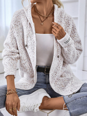 Textured knit zip-up cardigan in white with speckle detail and logo on sleeve.