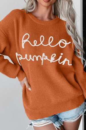 Terracotta knit sweater with white "Hello Pumpkin" script detail.