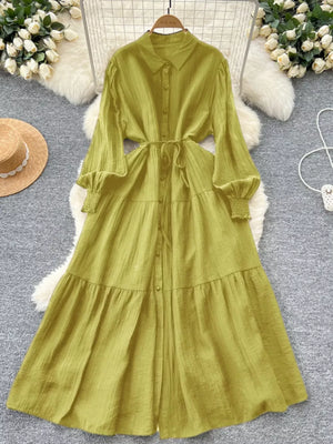 Yellow-green textured tiered long sleeve button-down midi dress with tie waist