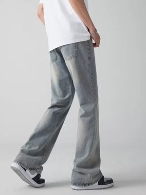 Men's light blue wide-leg jeans with a relaxed fit and vintage wash.