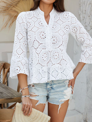 White eyelet embroidered peplum blouse with ruffles and bell sleeves.
