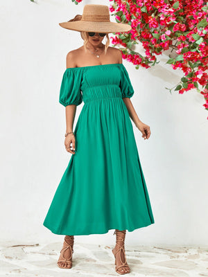Green off-shoulder midi dress with gathered bodice and balloon sleeves.